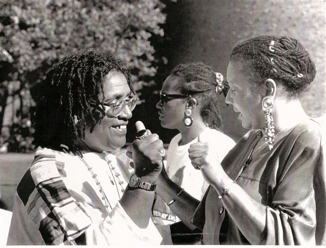 Shirley teaching Audre Lorde to sign.