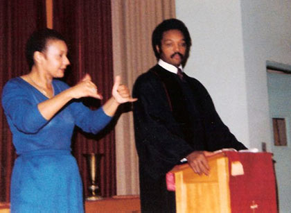 Shirley signing at a church service for Rev. Jesse Jackson.